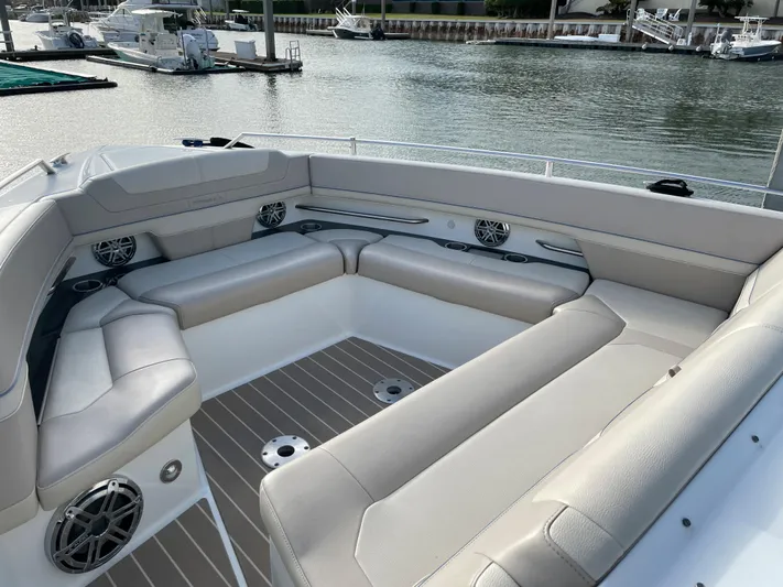 Yacht Photos Pics Luxurious seating area on a 2019 Formula 400 SSC boat, docked by the water.