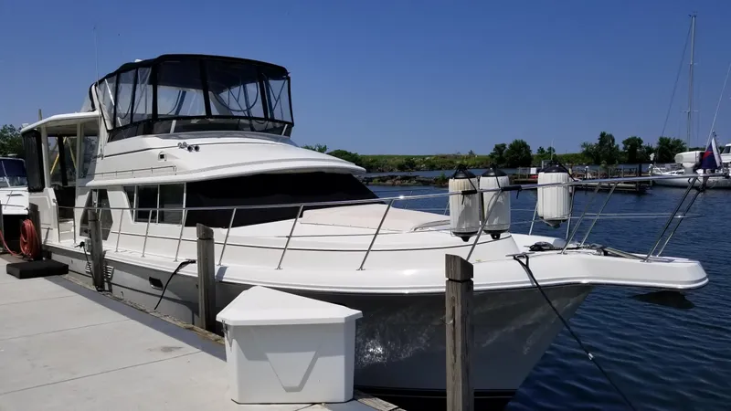  Yacht Photos Pics 1998 Carver 445 Aft Cabin Motor Yacht docked at marina.
