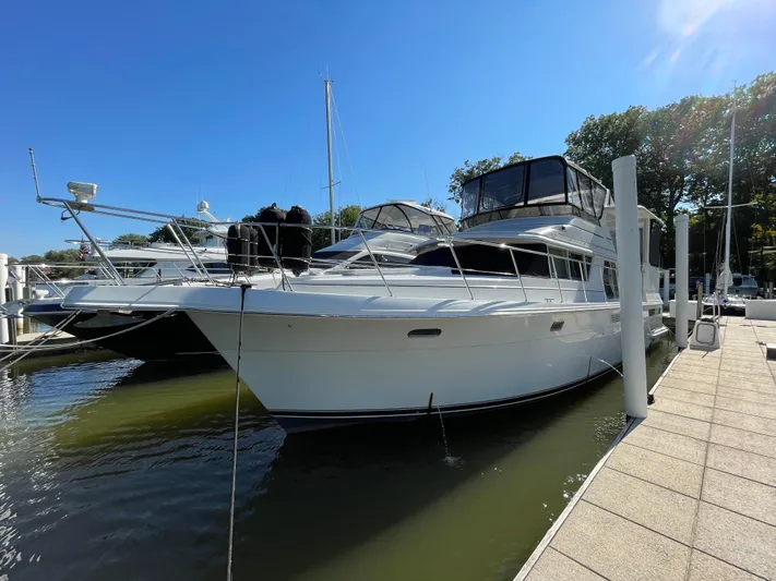  Yacht Photos Pics 1998 Carver 445 Aft Cabin Motor Yacht docked in sunny marina.