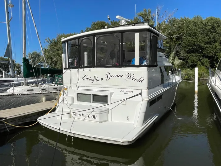  Yacht Photos Pics 1998 Carver 445 Aft Cabin Motor Yacht docked, featuring "Living in a Dream World" text.