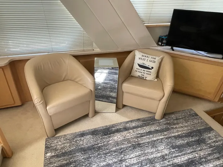  Yacht Photos Pics Interior of 1998 Carver 445 Aft Cabin Yacht with beige chairs and modern decor.