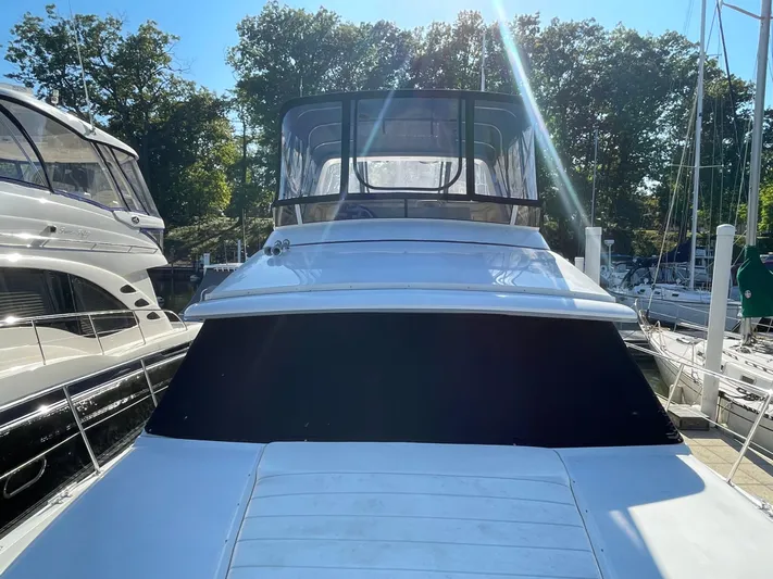  Yacht Photos Pics 1998 Carver 445 Aft Cabin Motor Yacht docked in marina, sunny day.