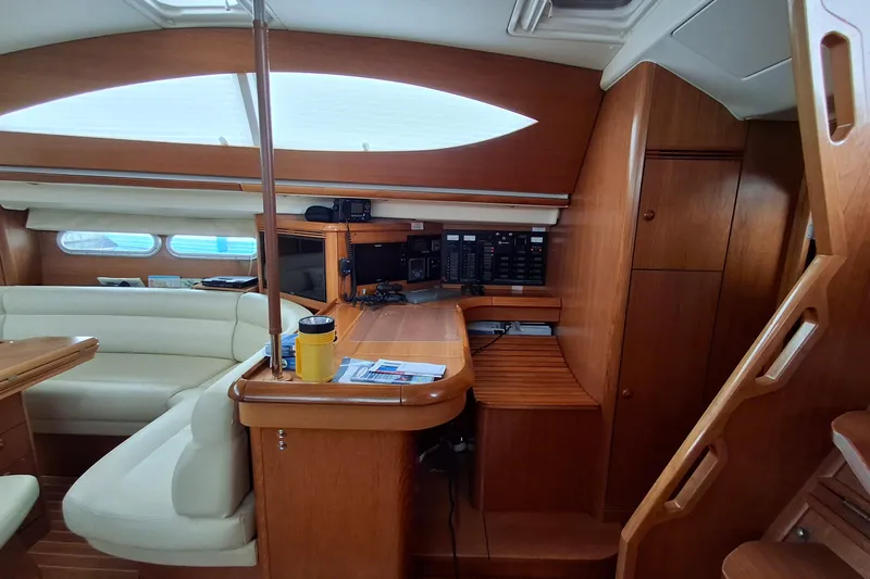 Majestic Yacht Photos Pics Interior of 2009 Jeanneau Sun Odyssey 54 DS yacht with wood finish and navigation equipment.