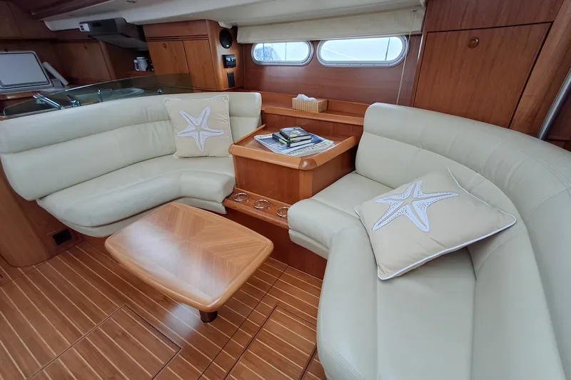 Majestic Yacht Photos Pics Luxurious interior of 2009 Jeanneau Sun Odyssey 54 DS yacht with elegant seating.