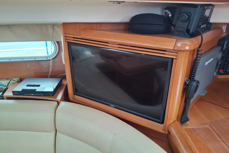 Majestic Yacht Photos Pics Interior of 2009 Jeanneau Sun Odyssey 54 DS with TV and navigation equipment.
