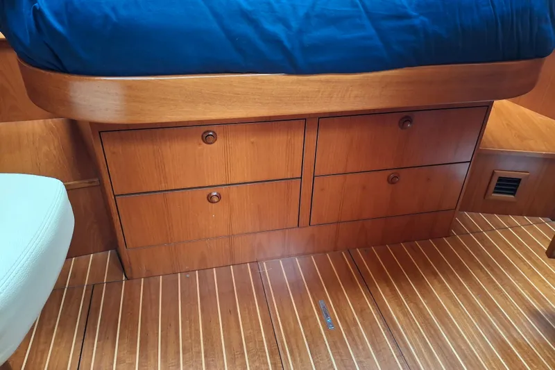 Majestic Yacht Photos Pics Wooden cabin drawers in a 2009 Jeanneau Sun Odyssey 54 DS yacht interior.