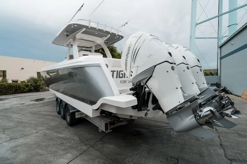 Tighten Up Yacht Photos Pics 2020 Intrepid 407 Panacea boat with triple Mercury outboard engines on a trailer.