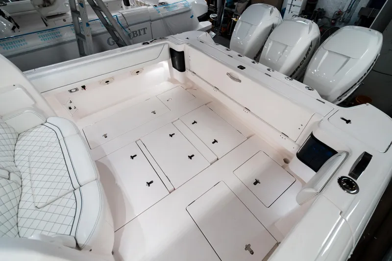 Tighten Up Yacht Photos Pics 2020 Intrepid 407 Panacea boat interior with storage compartments and seating.