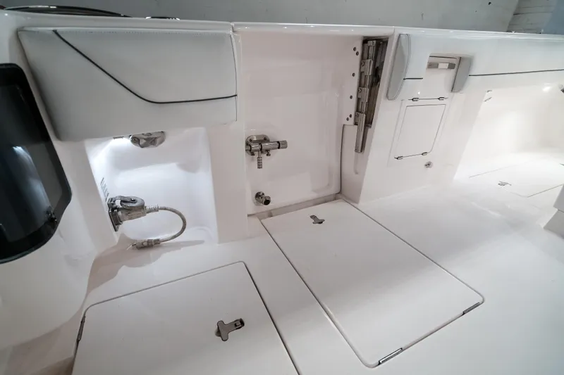 Tighten Up Yacht Photos Pics 2020 Intrepid 407 Panacea boat interior with sleek white design and storage compartments.