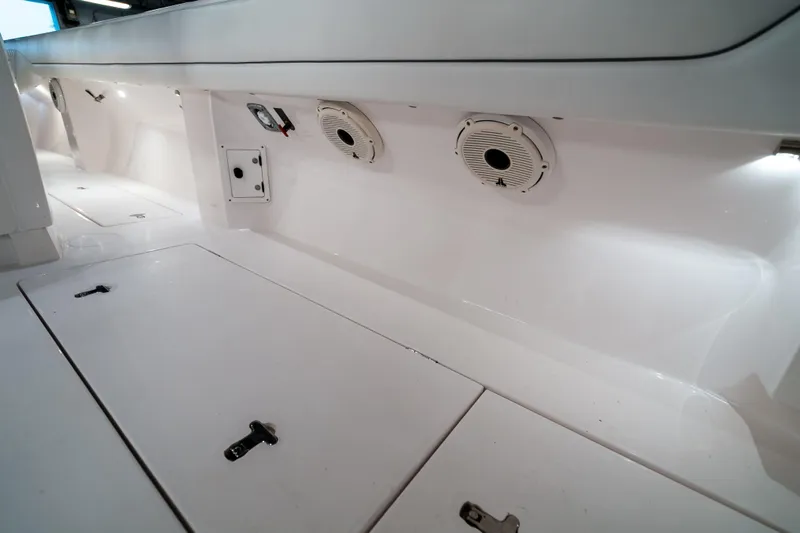 Tighten Up Yacht Photos Pics 2020 Intrepid 407 Panacea interior with storage compartments and speakers.