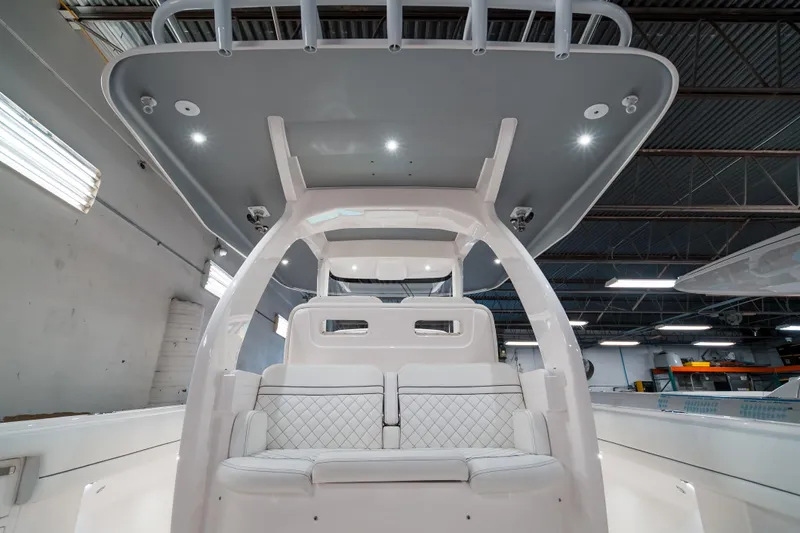 Tighten Up Yacht Photos Pics 2020 Intrepid 407 Panacea boat interior with modern seating and overhead lighting.