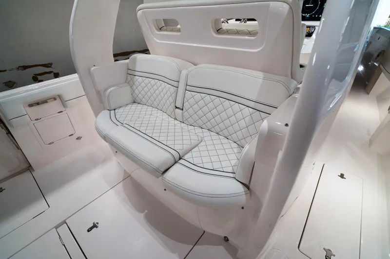 Tighten Up Yacht Photos Pics 2020 Intrepid 407 Panacea interior with luxurious white quilted seating.