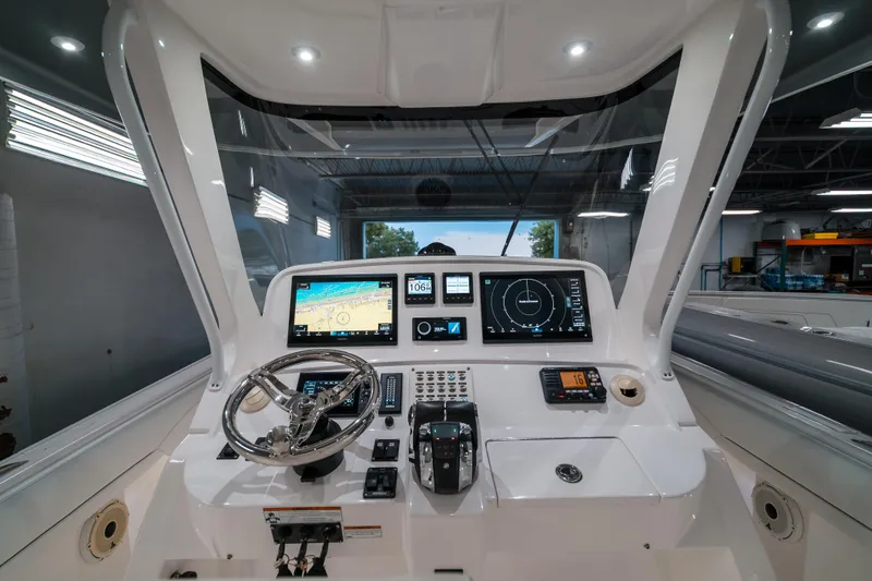 Tighten Up Yacht Photos Pics 2020 Intrepid 407 Panacea helm with advanced navigation displays and controls.