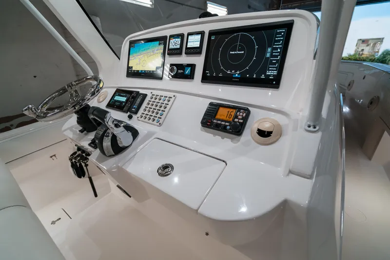 Tighten Up Yacht Photos Pics Control panel of 2020 Intrepid 407 Panacea boat with advanced navigation systems.
