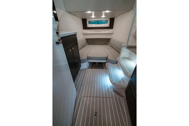 Tighten Up Yacht Photos Pics Luxurious interior of 2020 Intrepid 407 Panacea boat with modern seating and ambient lighting.