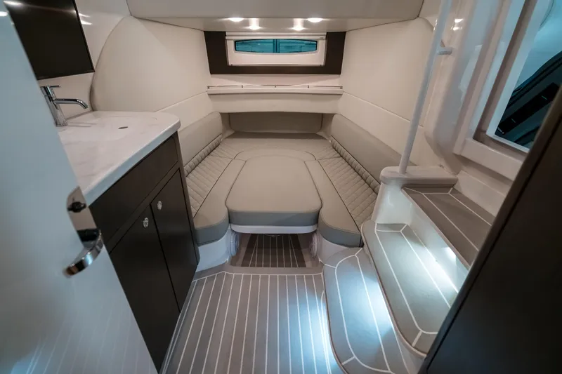 Tighten Up Yacht Photos Pics Luxurious interior of 2020 Intrepid 407 Panacea boat with modern seating and lighting.