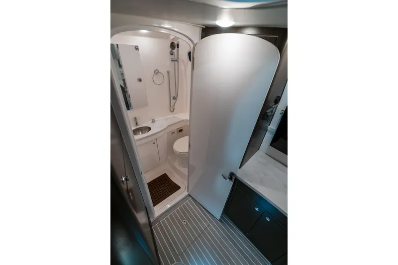 Tighten Up Yacht Photos Pics 2020 Intrepid 407 Panacea boat bathroom with shower, sink, and toilet.