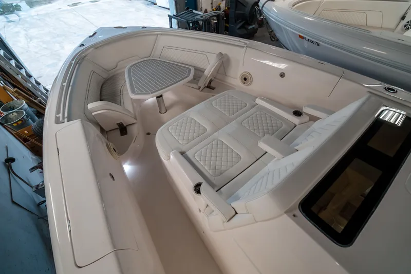 Tighten Up Yacht Photos Pics 2020 Intrepid 407 Panacea boat interior with white seating and table.