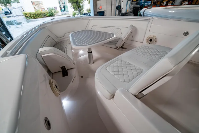 Tighten Up Yacht Photos Pics 2020 Intrepid 407 Panacea boat interior with white seating and table.