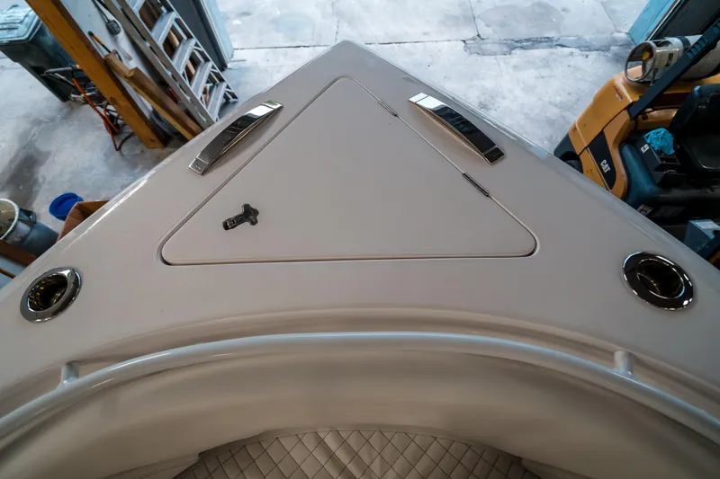 Tighten Up Yacht Photos Pics 2020 Intrepid 407 Panacea boat deck with storage compartment and chrome details.