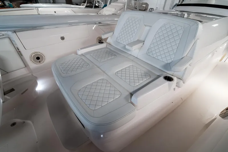 Tighten Up Yacht Photos Pics Luxurious seating on 2020 Intrepid 407 Panacea boat with diamond-stitched upholstery.
