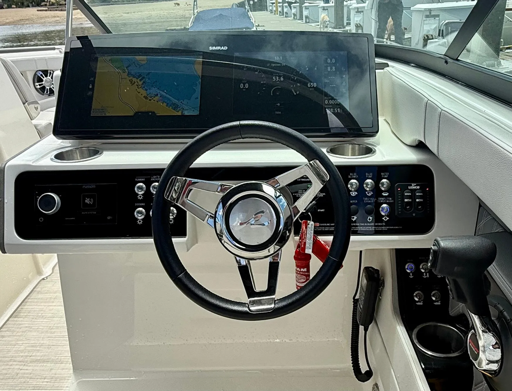2020 Sea Ray SLX 280 dashboard with steering wheel and navigation display.