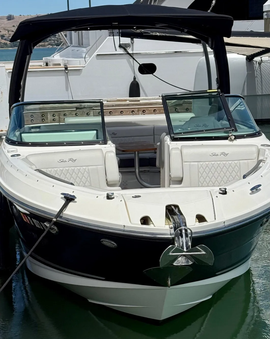 2020 Sea Ray SLX 280 boat docked, featuring sleek design and spacious seating.