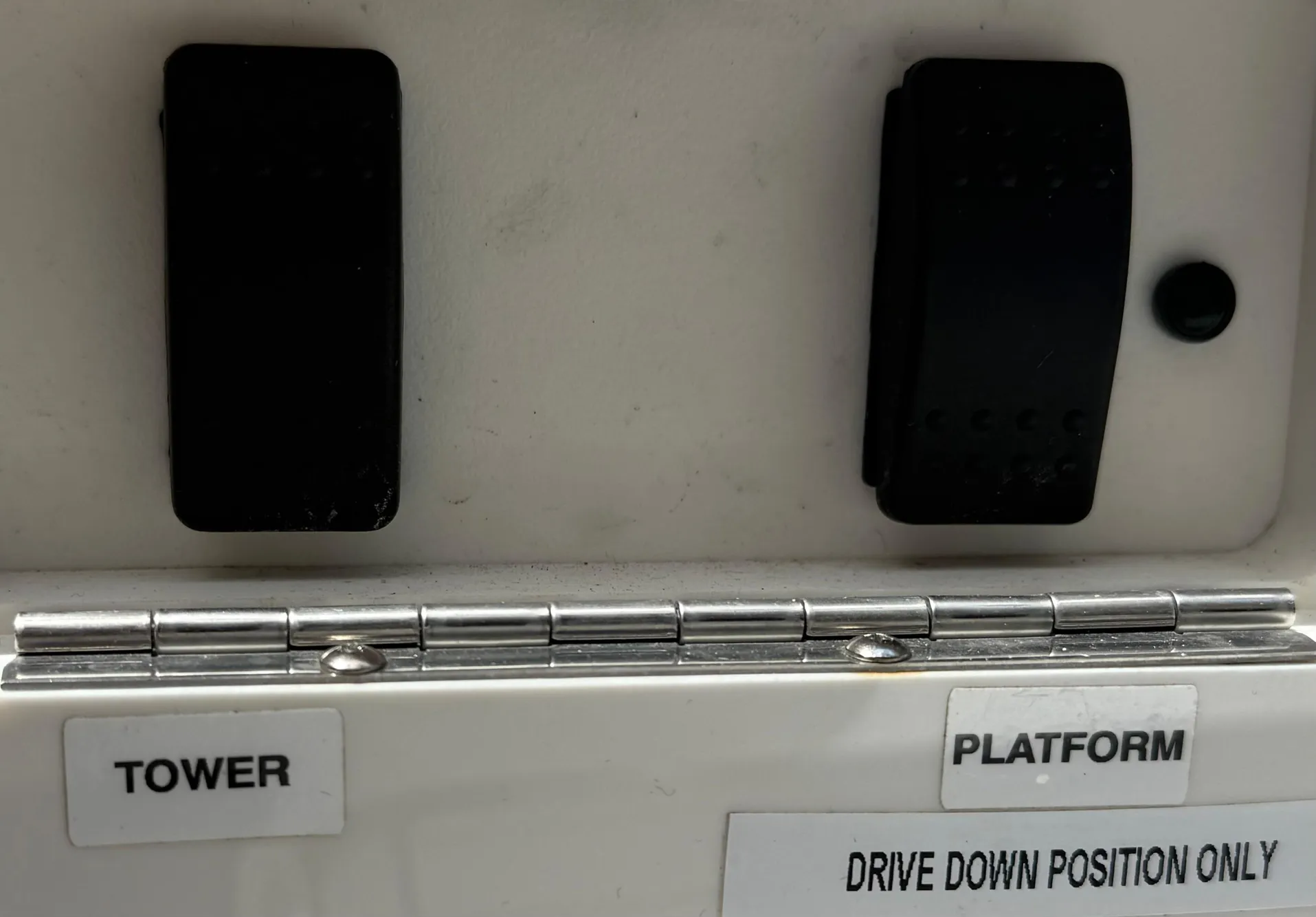 Control panel of a 2020 Sea Ray SLX 280 boat with tower and platform switches.