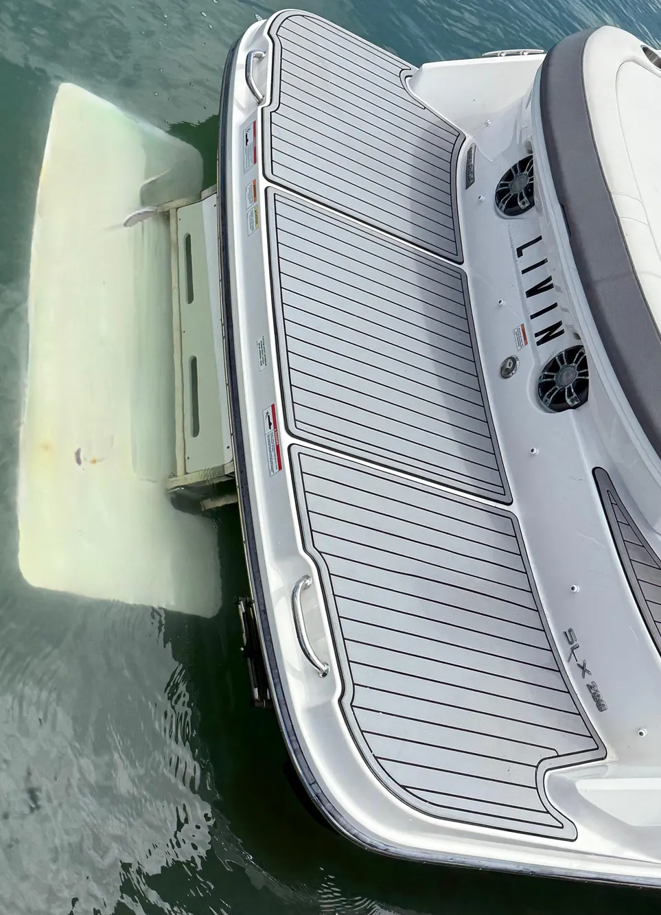 2020 Sea Ray SLX 280 boat with swim platform on water.
