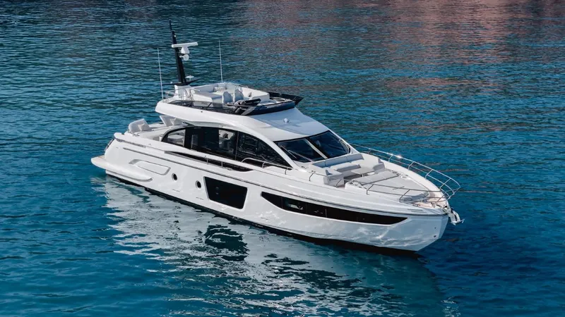  Yacht Photos Pics 2023 Azimut S7 luxury yacht cruising on clear blue water.