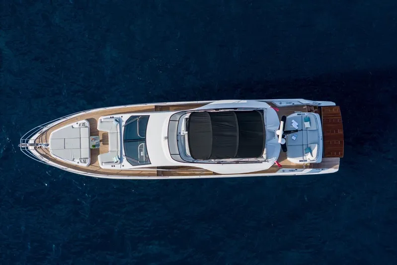  Yacht Photos Pics Aerial view of 2023 Azimut S7 yacht on deep blue water.