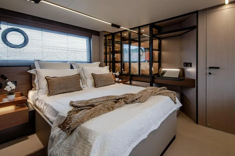  Yacht Photos Pics Luxurious bedroom interior of 2023 Azimut S7 yacht with modern design and elegant decor.