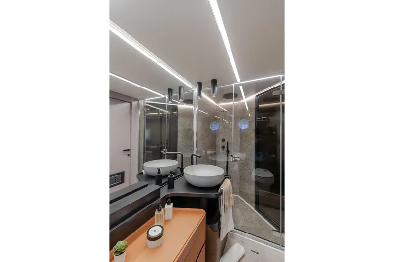  Yacht Photos Pics Luxurious bathroom interior of 2023 Azimut S7 yacht with modern fixtures and lighting.