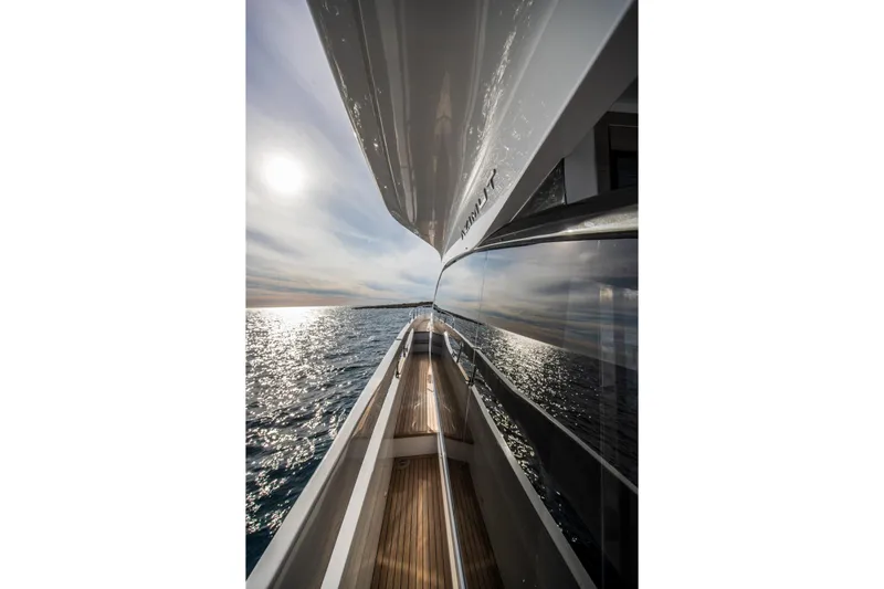  Yacht Photos Pics 2023 Azimut S7 yacht reflecting sunlight on the ocean.