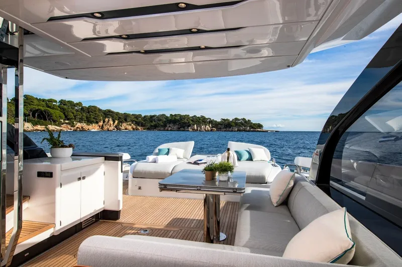  Yacht Photos Pics Luxurious 2023 Azimut S7 yacht deck with elegant seating and ocean view.