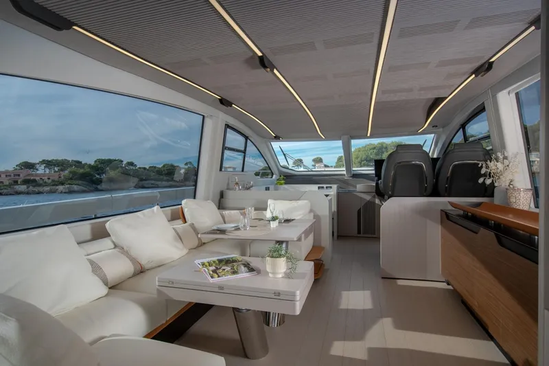  Yacht Photos Pics Luxurious interior of 2023 Azimut S7 yacht with modern seating and panoramic windows.