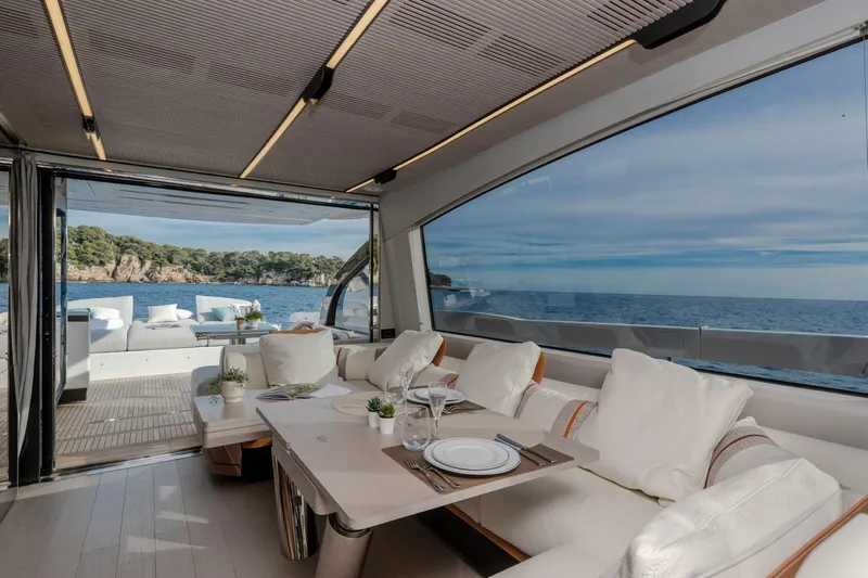  Yacht Photos Pics Luxurious interior of 2023 Azimut S7 yacht with ocean view and elegant dining setup.