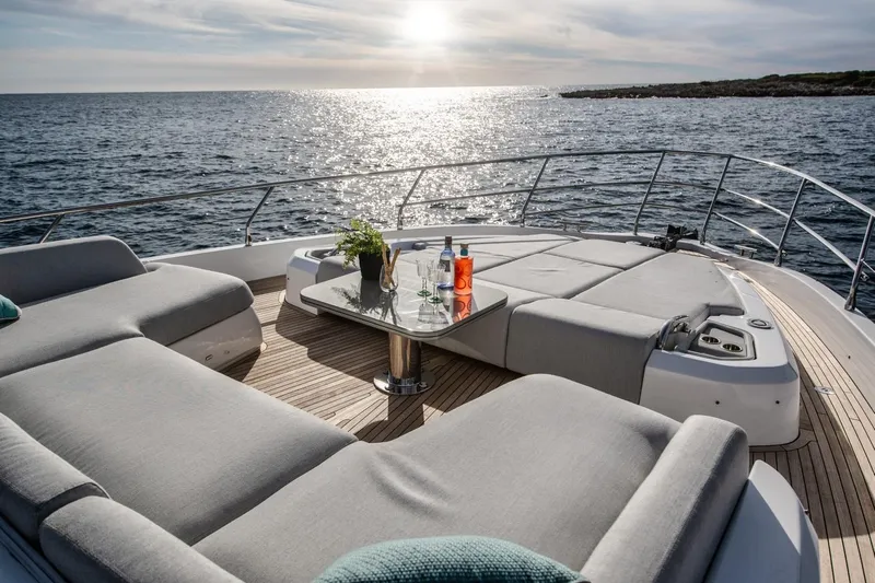  Yacht Photos Pics Luxurious 2023 Azimut S7 yacht deck with sun loungers and ocean view.