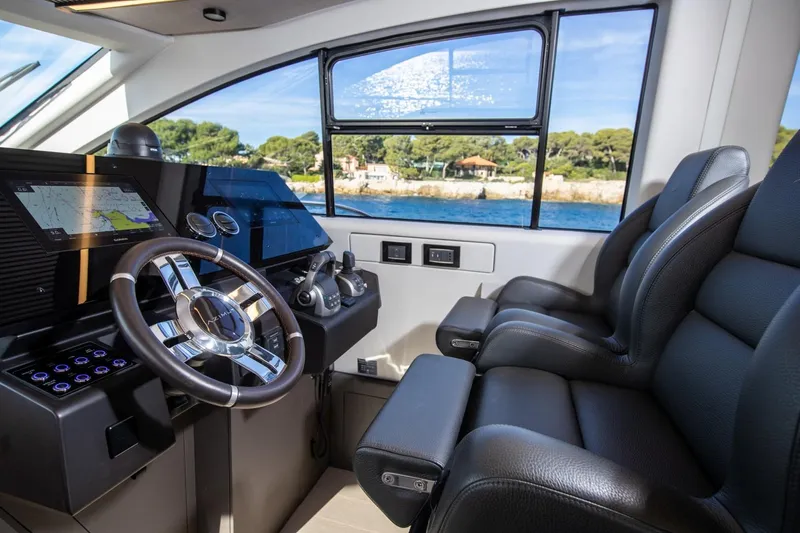  Yacht Photos Pics Interior of 2023 Azimut S7 yacht cockpit with modern controls and leather seating.