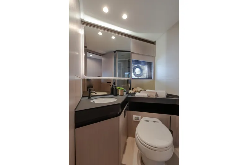  Yacht Photos Pics Luxurious bathroom in 2023 Azimut S7 yacht with modern fixtures and elegant design.