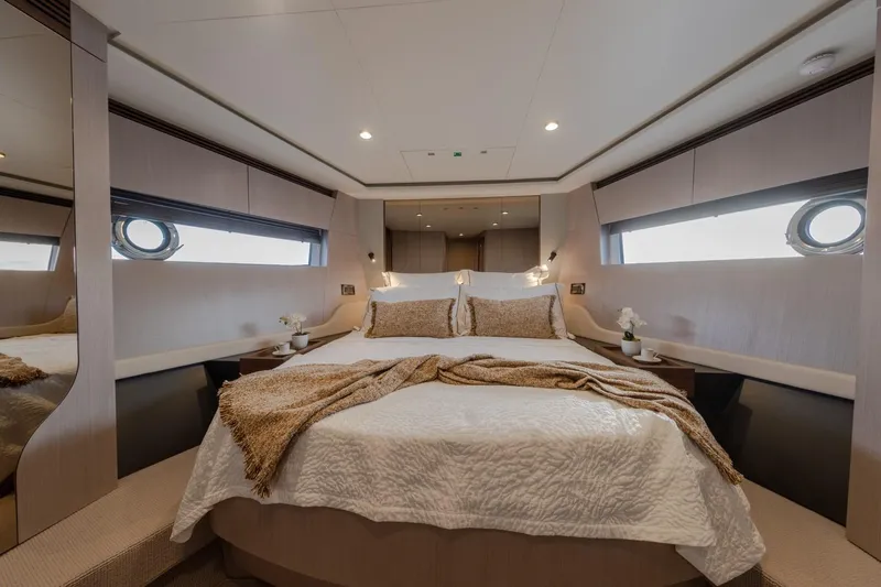  Yacht Photos Pics Luxurious bedroom interior of 2023 Azimut S7 yacht with elegant decor and cozy bedding.