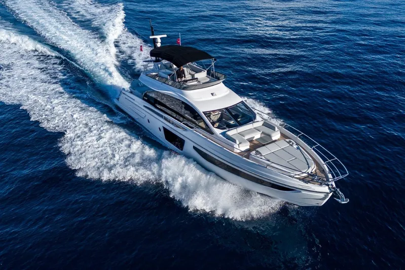  Yacht Photos Pics 2023 Azimut S7 yacht cruising on open blue sea, aerial view.