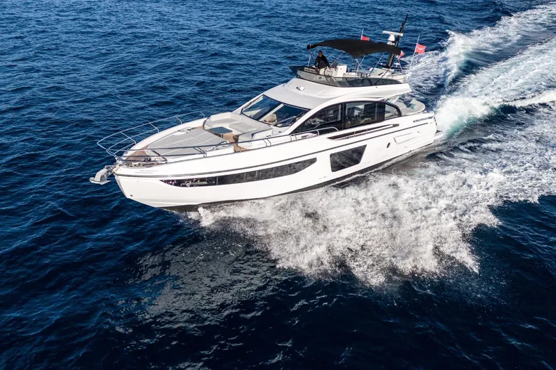  Yacht Photos Pics 2023 Azimut S7 yacht cruising on open blue sea, showcasing sleek design and luxury.
