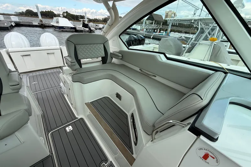  Yacht Photos Pics 2023 Pursuit DC 326 Dual Console boat interior with sleek seating and modern design.