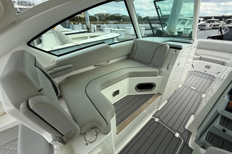  Yacht Photos Pics 2023 Pursuit DC 326 Dual Console interior with luxurious seating and sleek design.