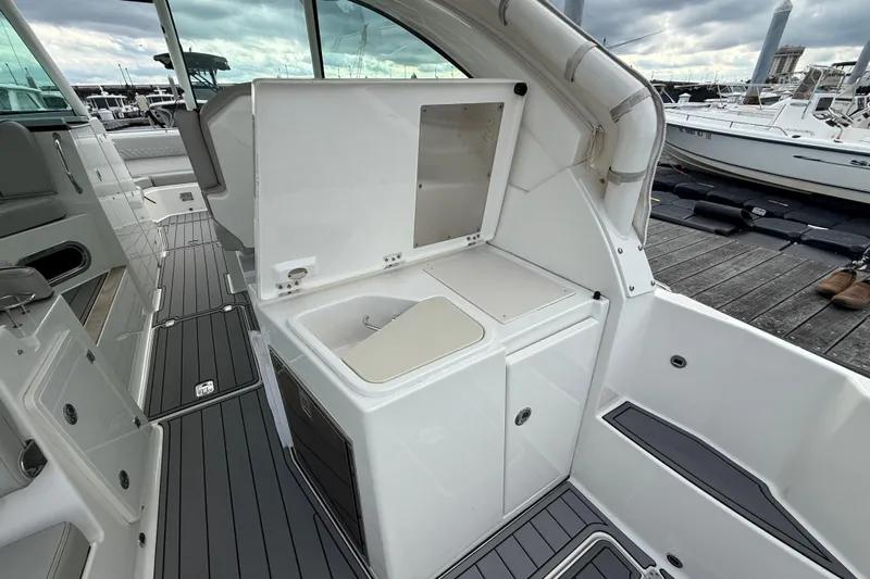  Yacht Photos Pics 2023 Pursuit DC 326 Dual Console boat interior with sleek design and modern amenities.