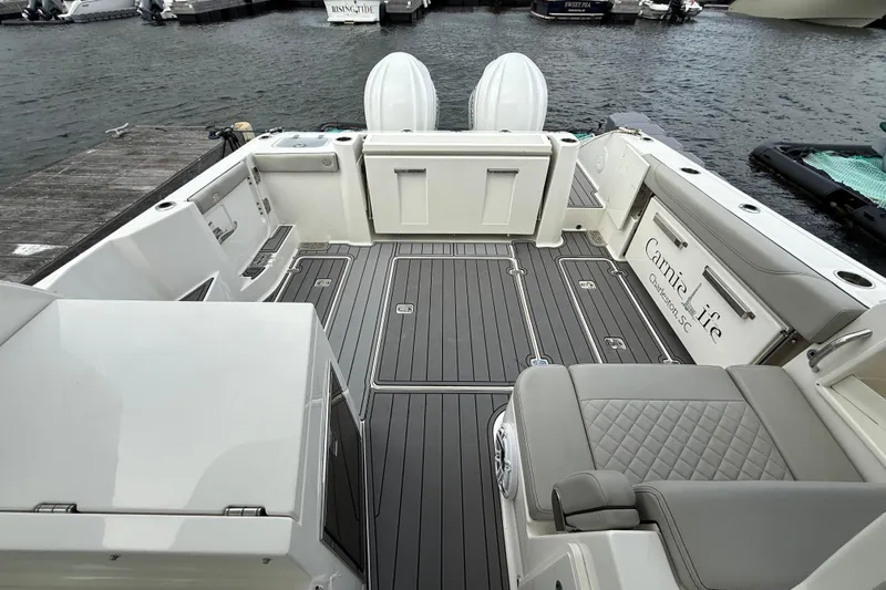  Yacht Photos Pics 2023 Pursuit DC 326 Dual Console boat interior with sleek seating and modern design.