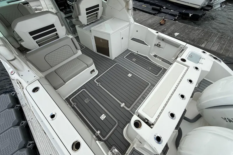  Yacht Photos Pics 2023 Pursuit DC 326 Dual Console boat interior with sleek seating and modern design.