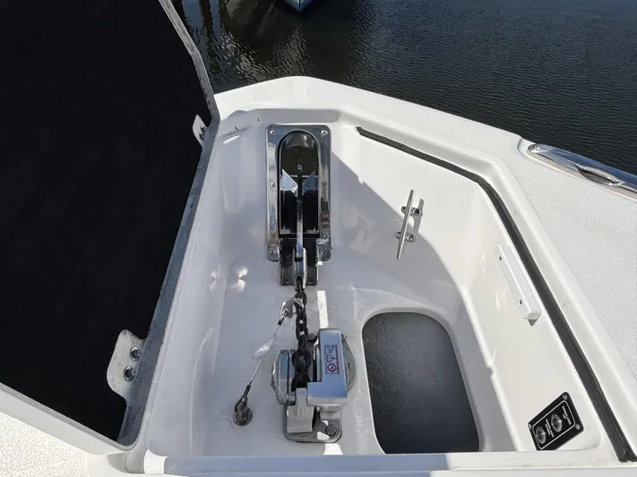  Yacht Photos Pics 2023 Sea Fox 328 Commander anchor compartment with winch and chain, open hatch view.