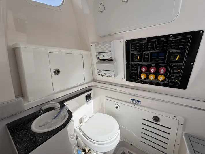  Yacht Photos Pics 2023 Sea Fox 328 Commander boat interior with control panel, sink, and toilet.